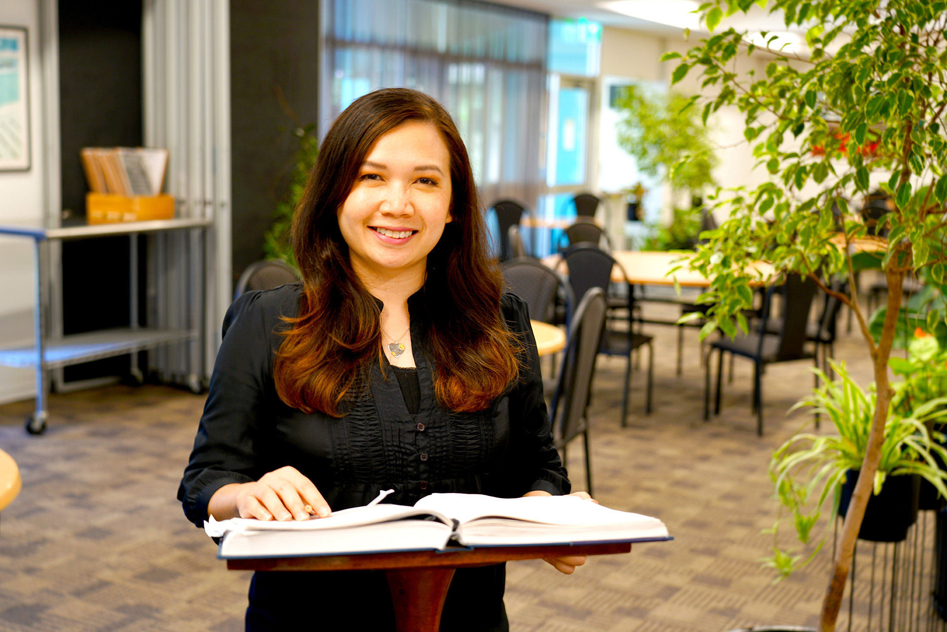 TAFE student at front of hospitality workplace setting