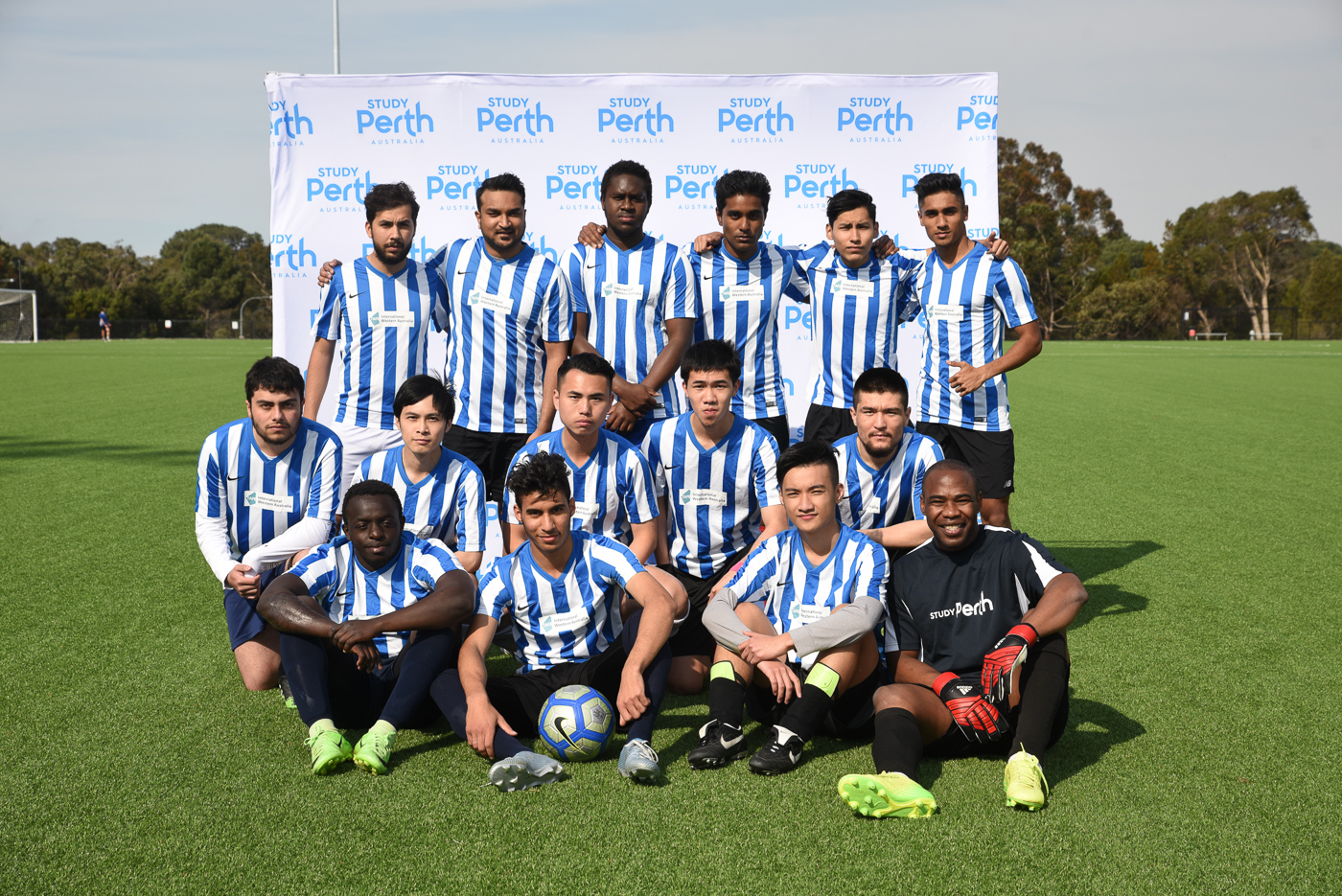 Group of TAFE students pose for photo at their graduation event