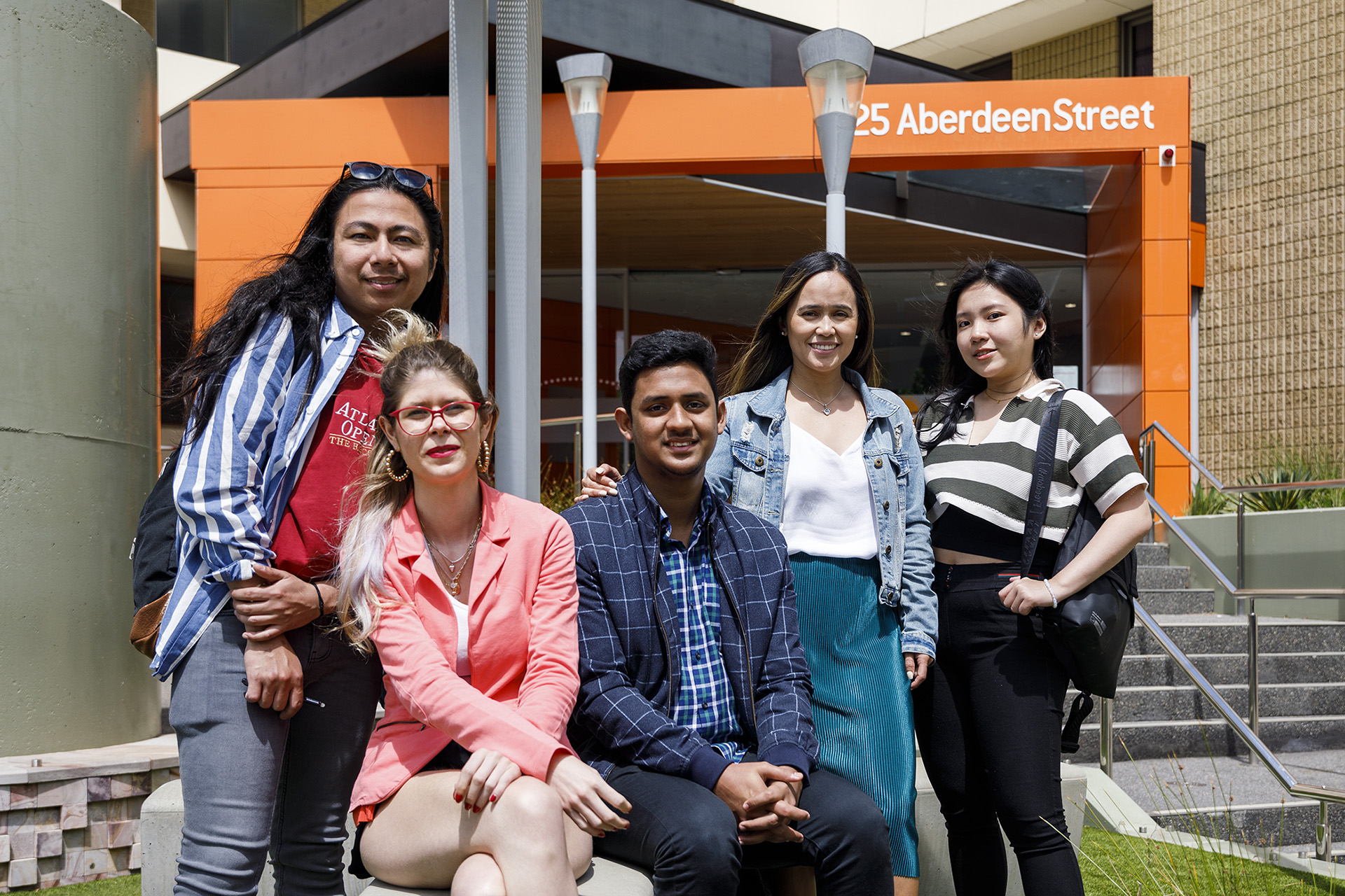 Group of five students together at TAFE campus
