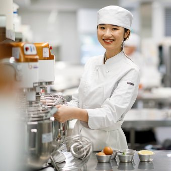 Chef standing in kitchen facility