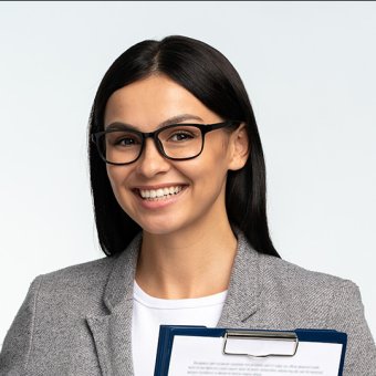 Yung person wearing business attire, holding up finger