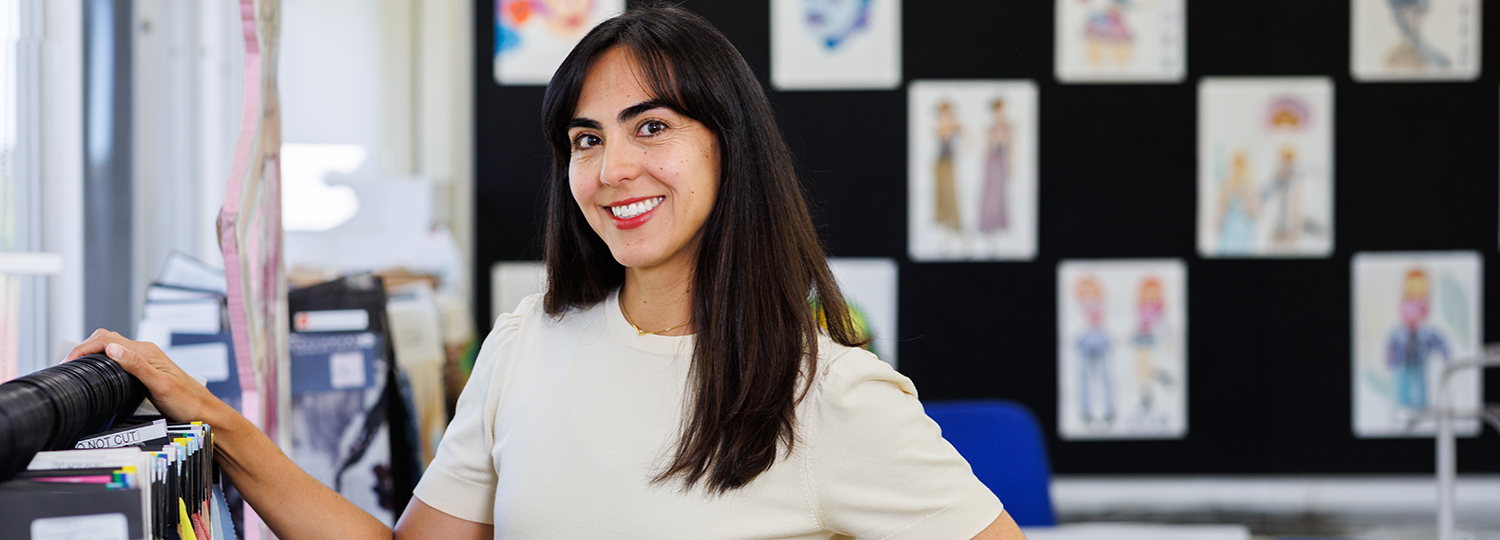 Fashion student with designs