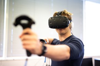 student using virtual reality equipment