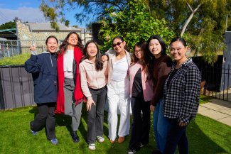 TAFE students standing in garden