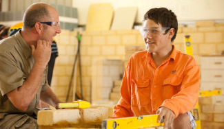 Bricklaying student with lecturer