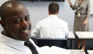 Person in aviation attire in a classroom