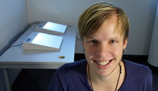 Person in a room with light boxes