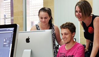 People in front of a computer