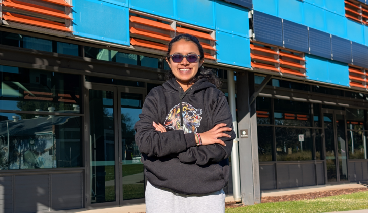 Student in front of campus