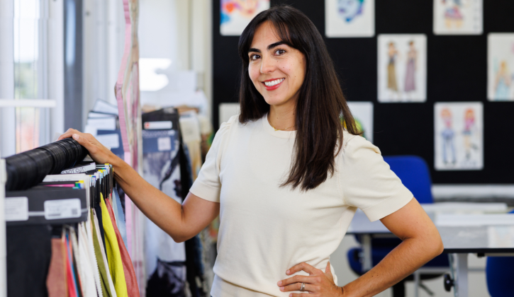 Fashion student with designs