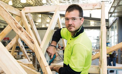 Person working on woodwork structure