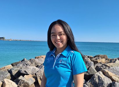TIWA student Keana, posing in front of Western Australian coastline