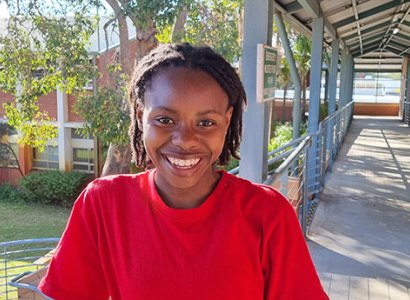 TIWA student Kudzai, posing on TAFE campus