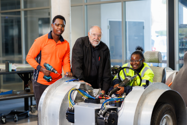 Mechanical engineering student working on vehicle