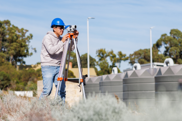 Civil construction design student in field